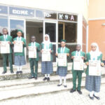 Students of Key Special Academy, Gwarinpa,Abuja displays copies of Teen Trust