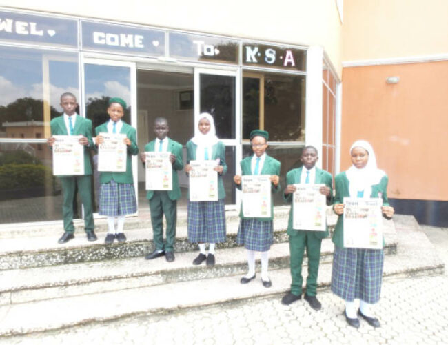 Students of Key Special Academy, Gwarinpa,Abuja displays copies of Teen Trust