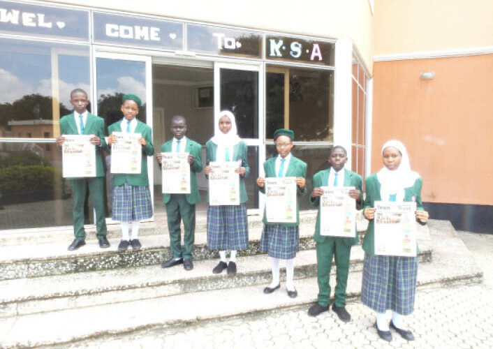 Students of Key Special Academy, Gwarinpa,Abuja displays copies of Teen Trust