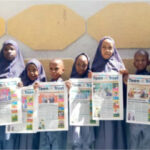 Students of Raudatul-afnan and Islamic model school displaying copies of Teen Trust