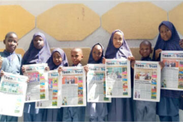 Students of Raudatul-afnan and Islamic model school displaying copies of Teen Trust