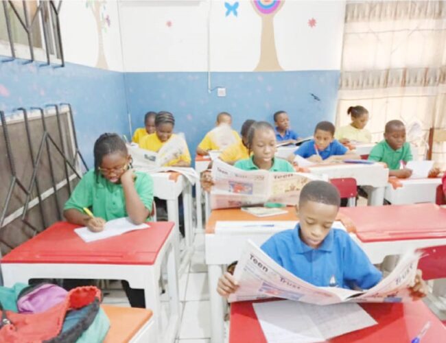 Students of Lordswill Academy, Abuja digesting the content of the Teen Trust Newspaper