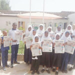 Student of High Quality Comprehensive School with copies of Teen Trust