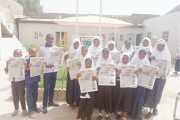 Student of High Quality Comprehensive School with copies of Teen Trust