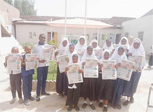 Student of High Quality Comprehensive School with copies of Teen Trust